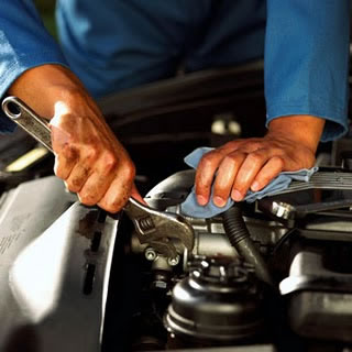 Mechanic repairing a muffler
